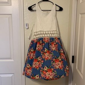 Only worn once. summery elegant short dress no longer needed in my closet